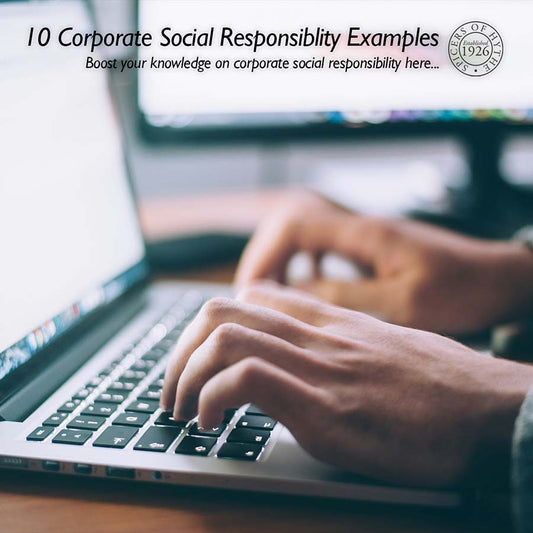 A person typing on a laptop keyboard