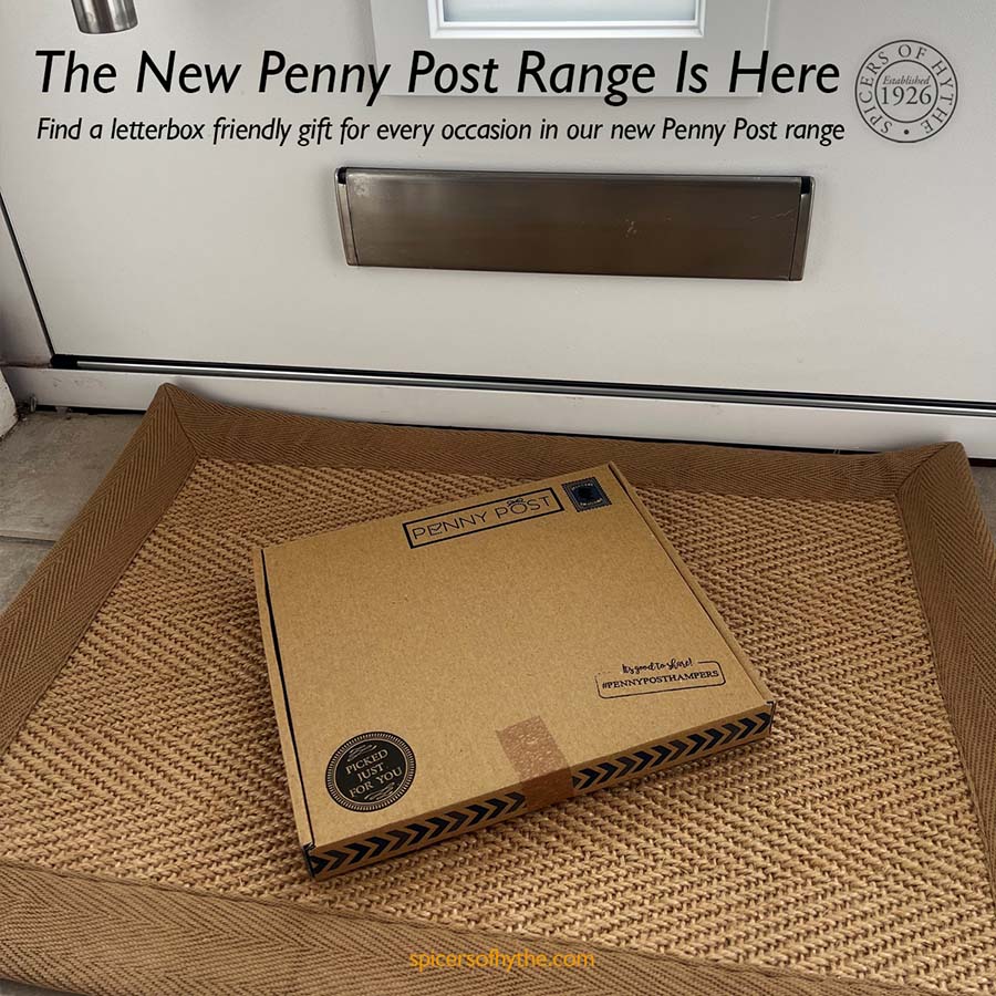 A Penny Post gift box laid through the letterbox of a house.